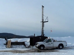 Geological Drill Station with truck in foreground